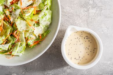Teriyaki restaurant 3-ingredient dressing in a small white dish next to a salad