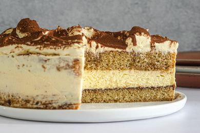 Side view of tiramisu cake cut into.