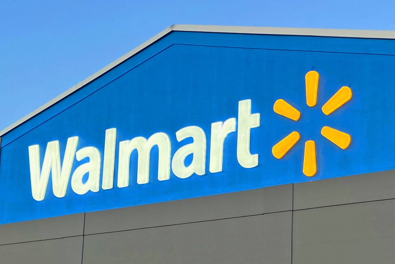The Walmart logo and name on the side of a building