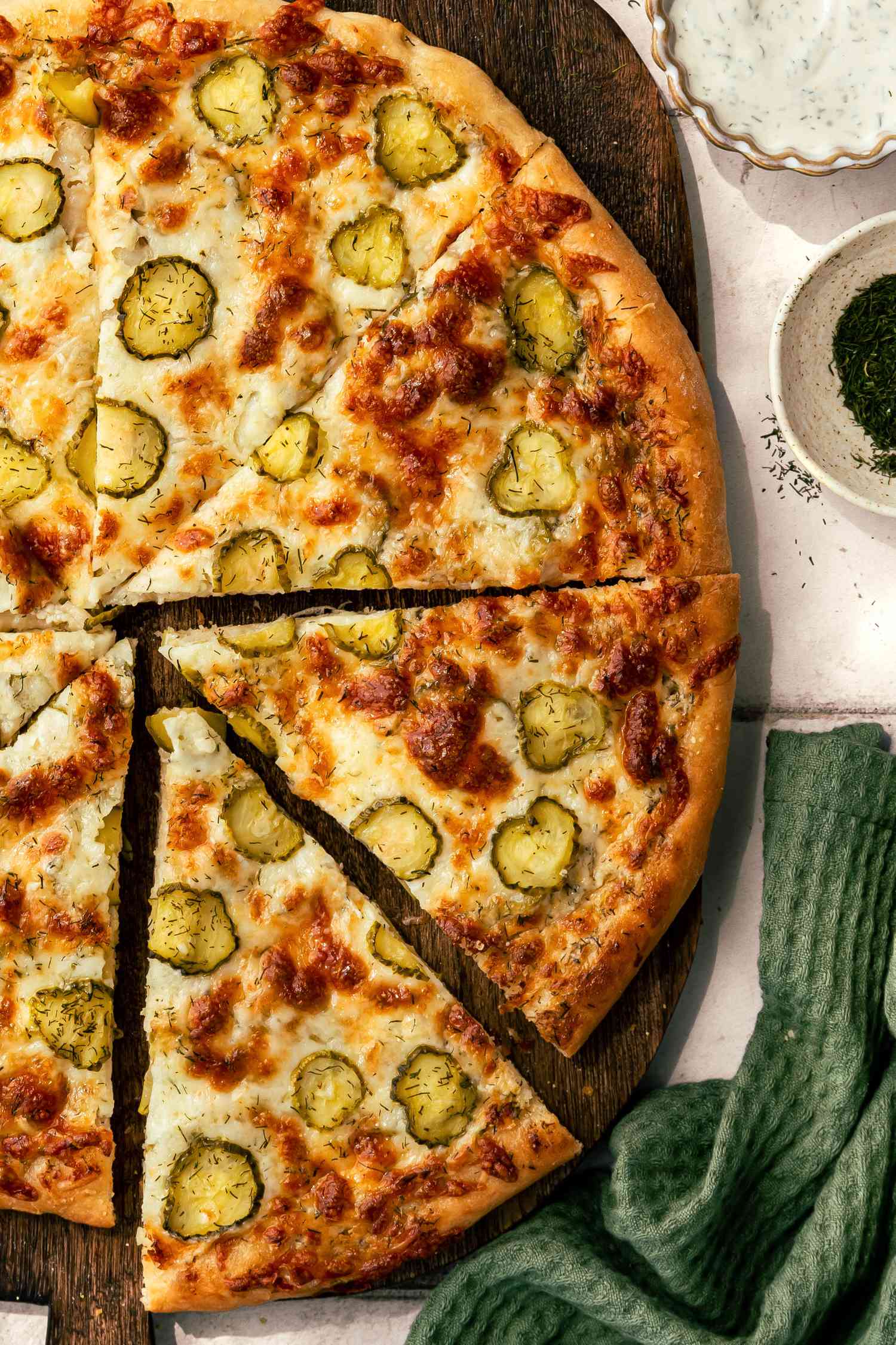 pickle pizza on a cutting board