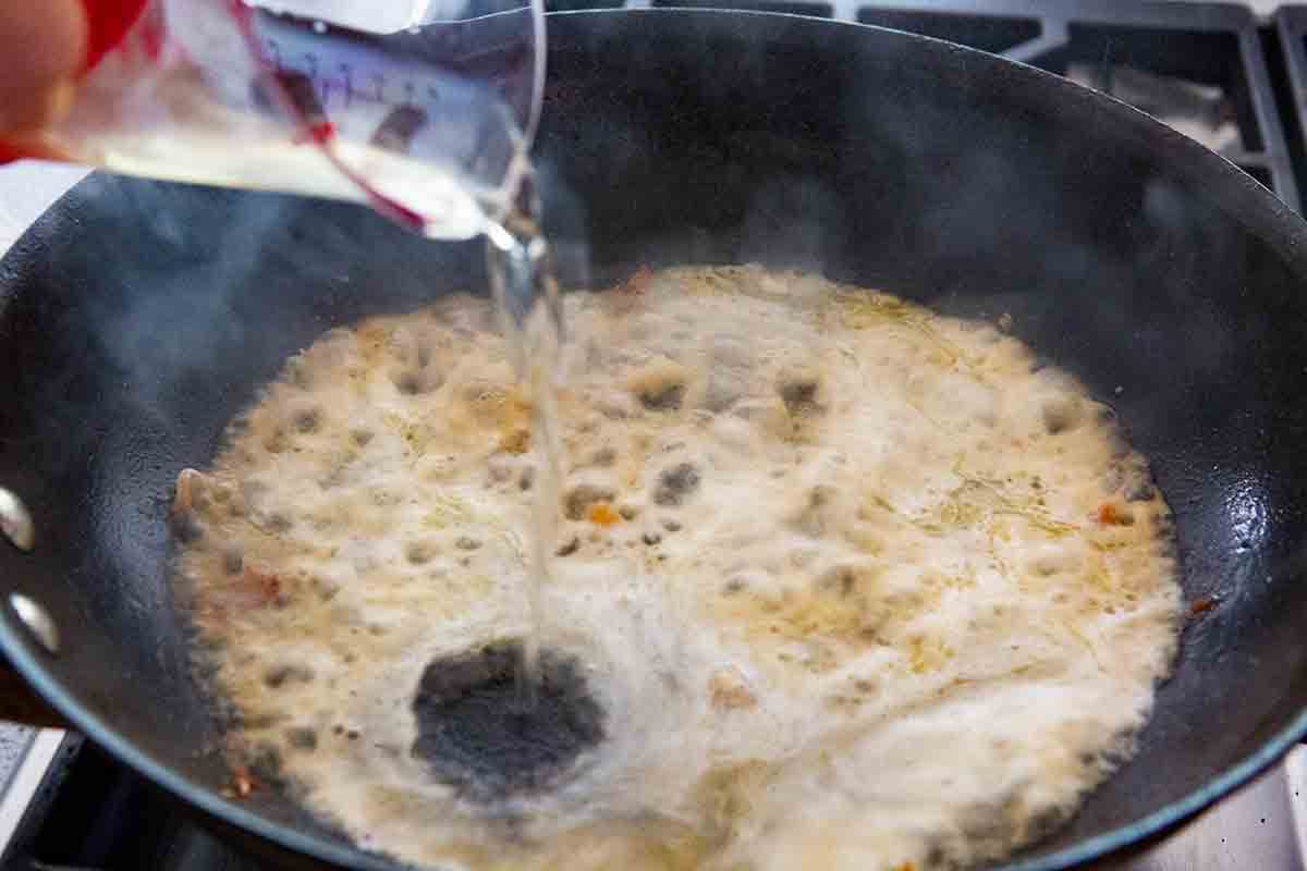 Deglazing a hot skillet with white wine