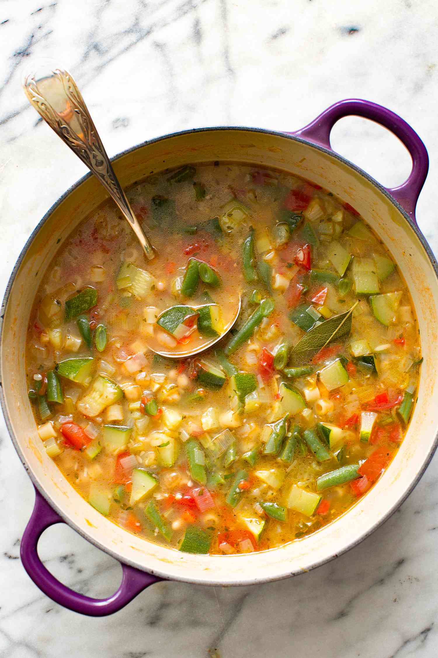 Summer Minestrone Soup in a Dutch Oven With a Ladle