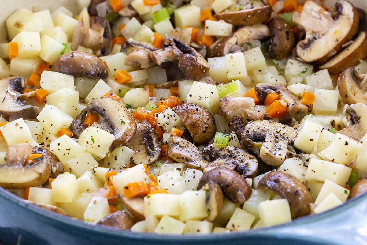 Vegetable pot pie filling of mushrooms, potatoes, carrots and celery.