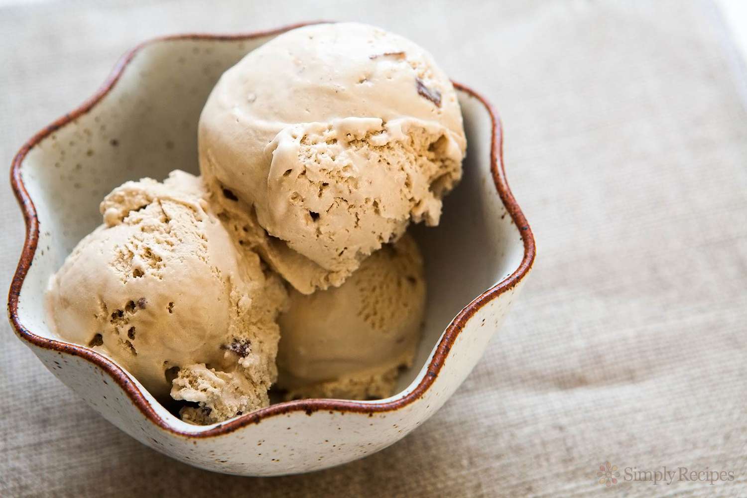 A bowl with three scoops of coffee Heath bar ice cream