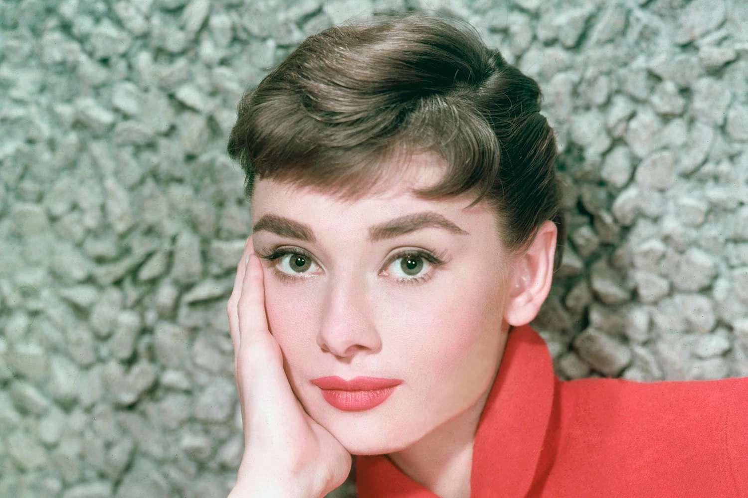 A head shot of Audrey Hepburn in her early 20s