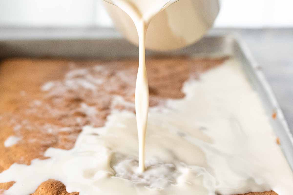 Mexican Tres Leches Cake pour the milk mixture on top of the cake