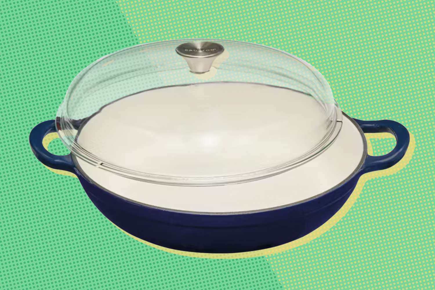 A cooking pan with a glass lid, featuring side handles on a patterned background