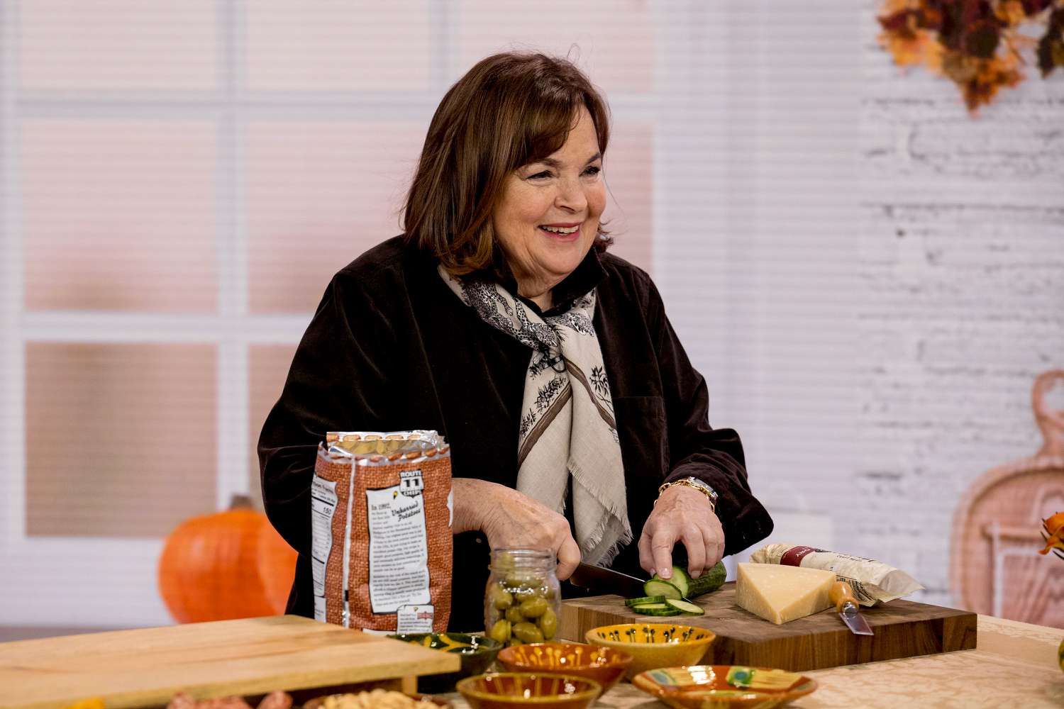 Ina Garten cutting a cucumber