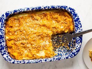 overhead view of Easy Pumpkin Lasagna in a casserole dish with a serving removed and a spatula