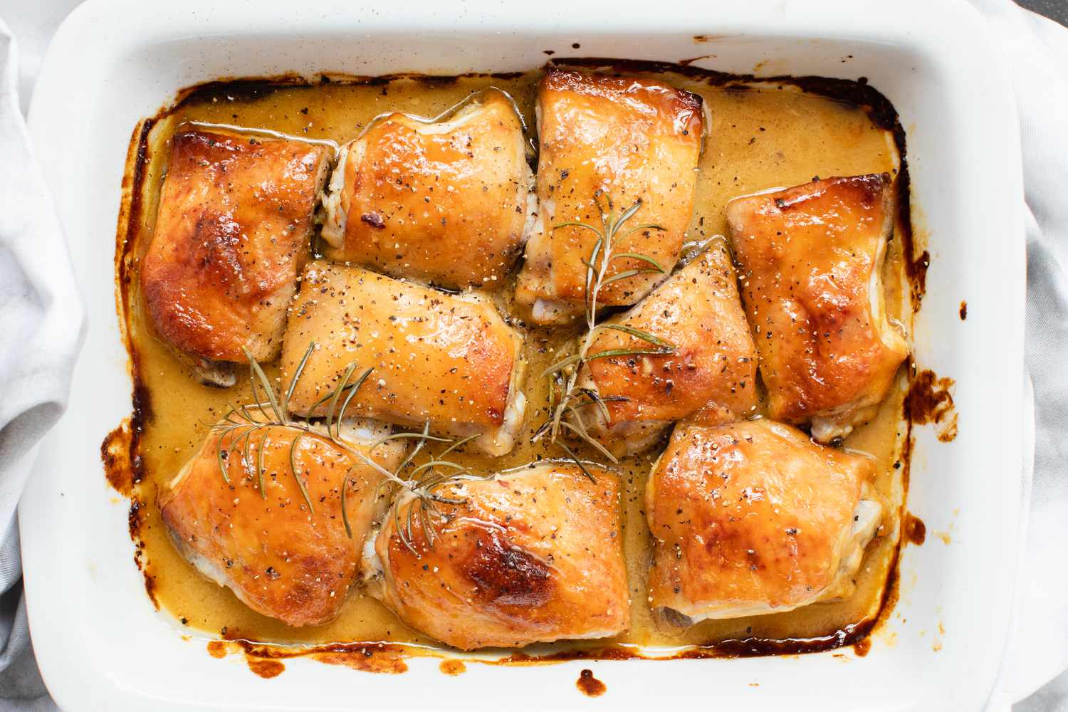 Overhead view of Honey Mustard Chicken baked in a casserole dish.