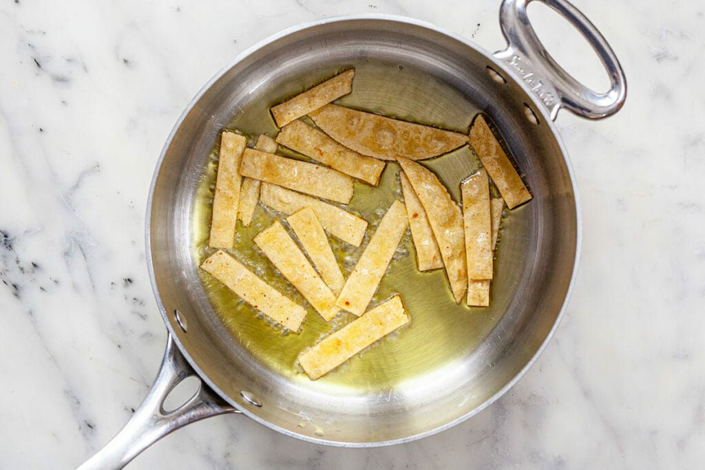 tortilla strips in frying pan
