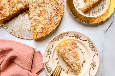 Coconut Macaroon Cake on a dessert plate with a fork