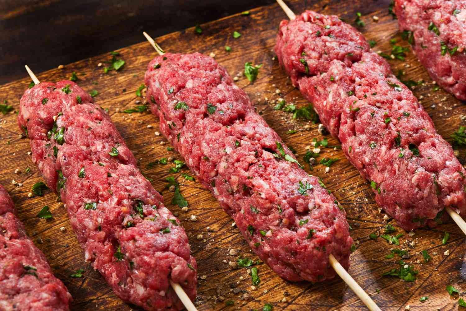 raw kebabs on a cutting board