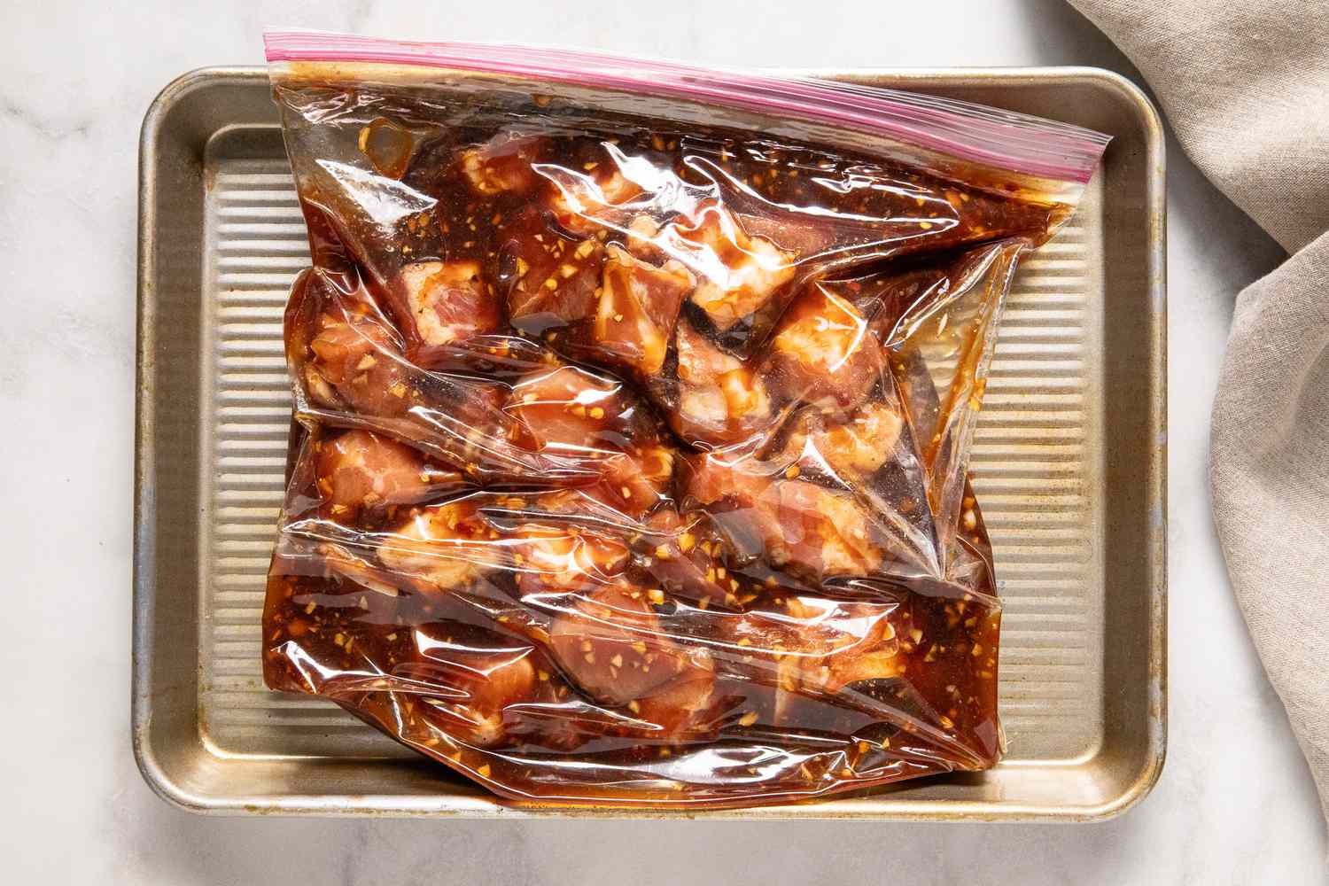 pork and marinade in a zip-top plastic bag