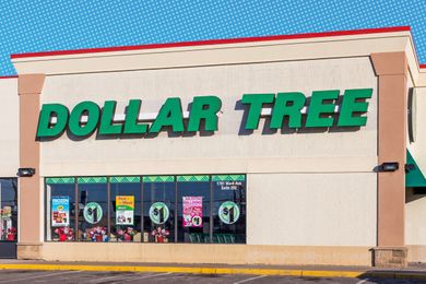 The storefront of a Dollar Tree retail store with visible signage and promotion posters on the windows