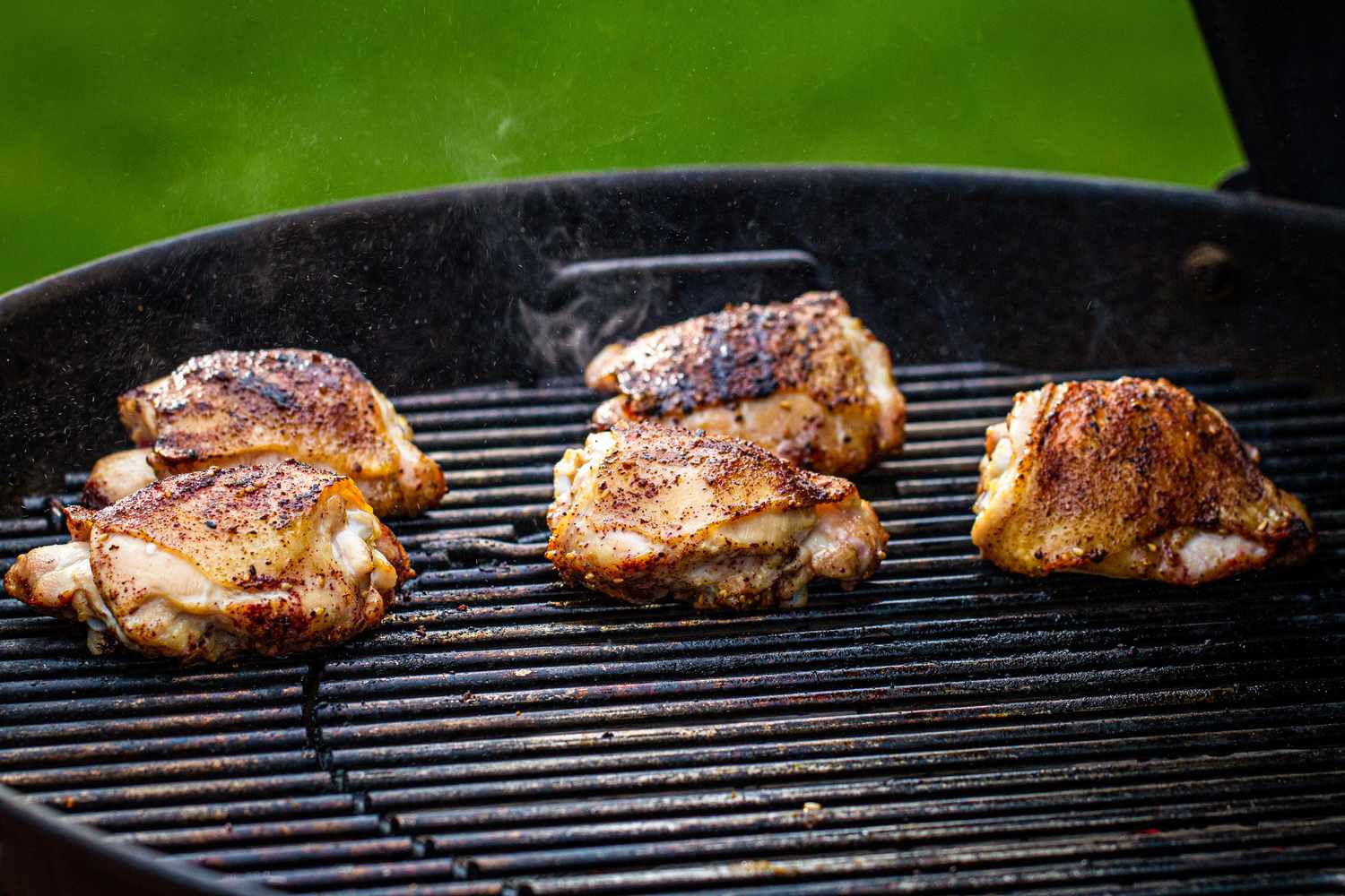 Chicken thighs on a Weber charcoal grill