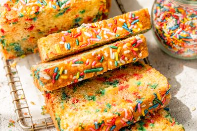ice cream bread slices on a wire rack, and in the surroundings, a jar with sprinkles on the counter