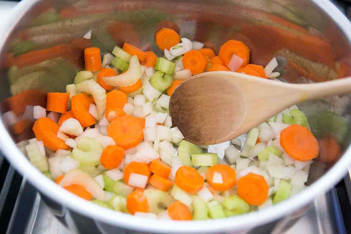 cook a mirepoix of onions, carrots, and celery as the base for easy chicken soup