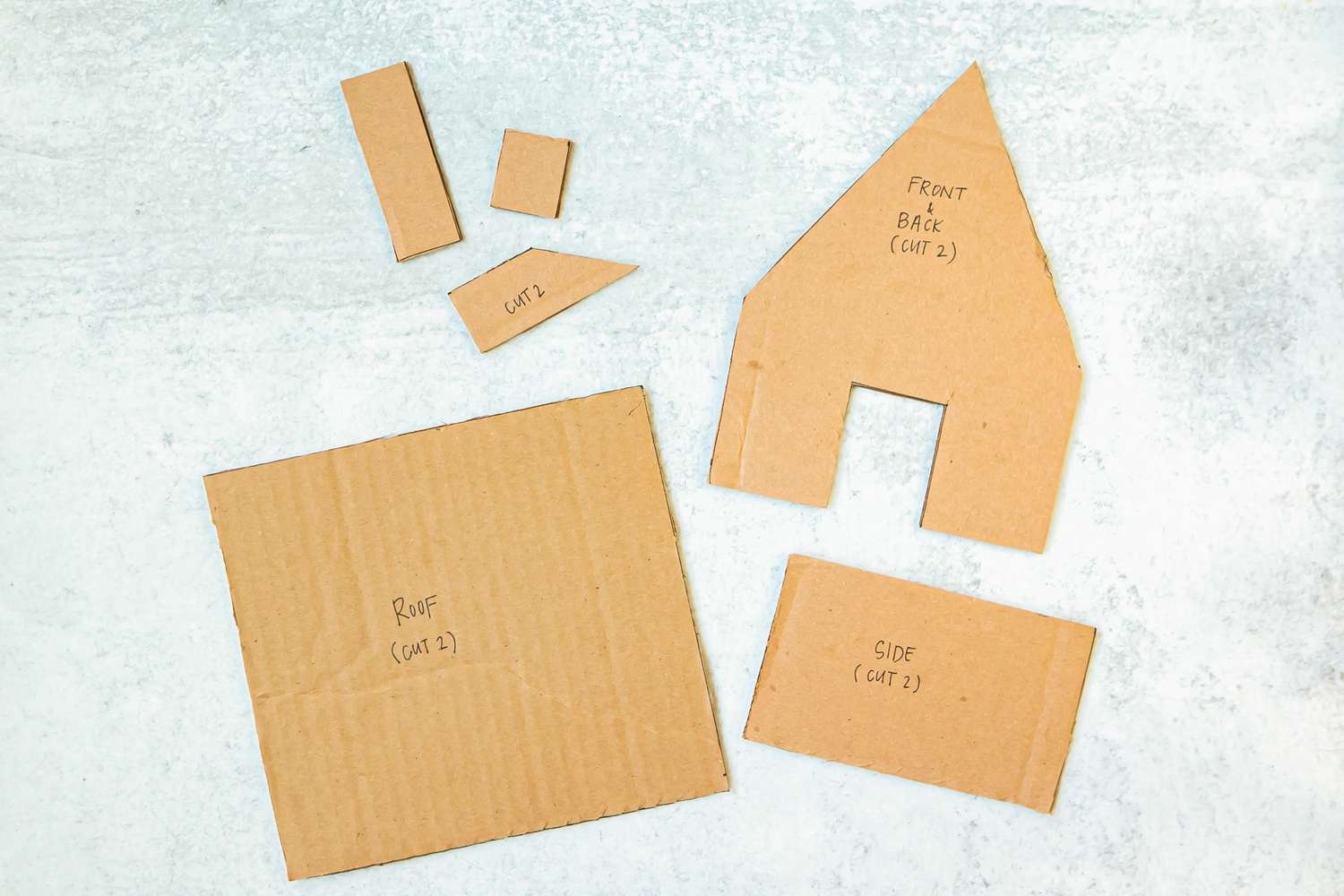 A gingerbread house template laid out and labeled.