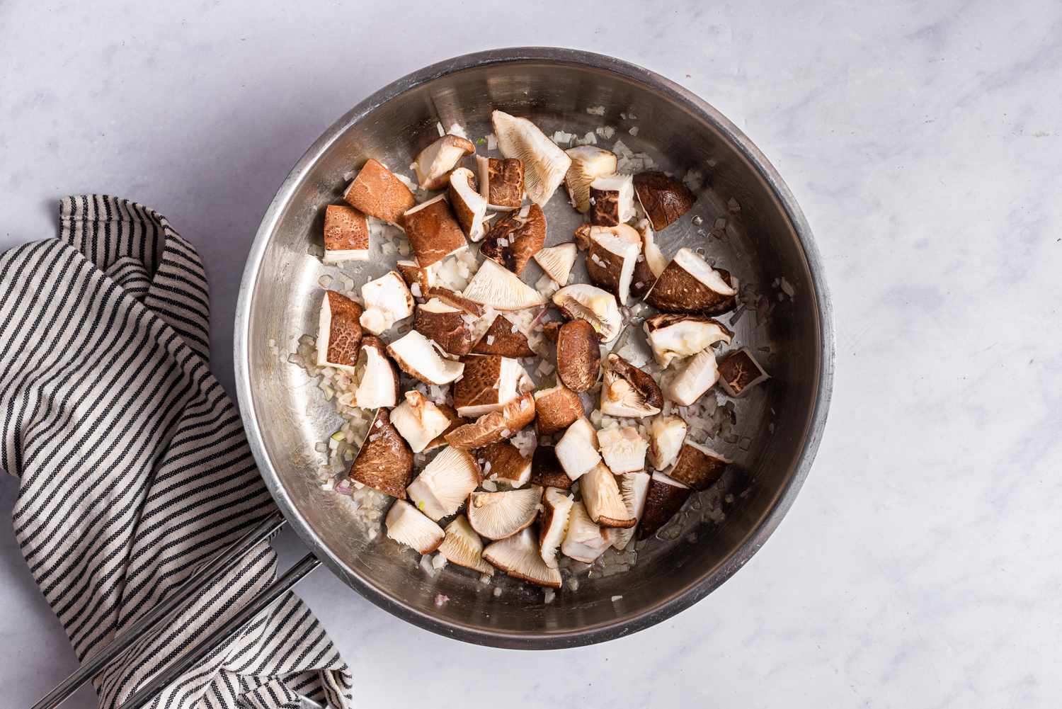 A pot of chopped mushrooms to show how to make risotto.