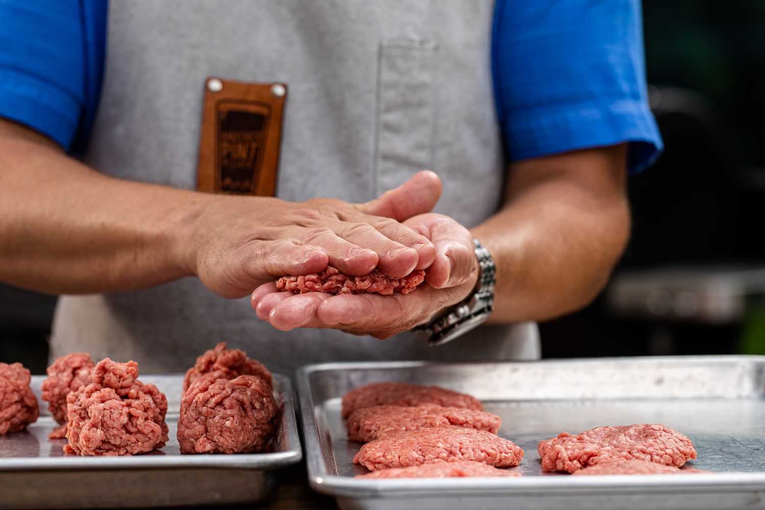 Pressing ground beef into patties for a copy cat Juicy Lucy burger
