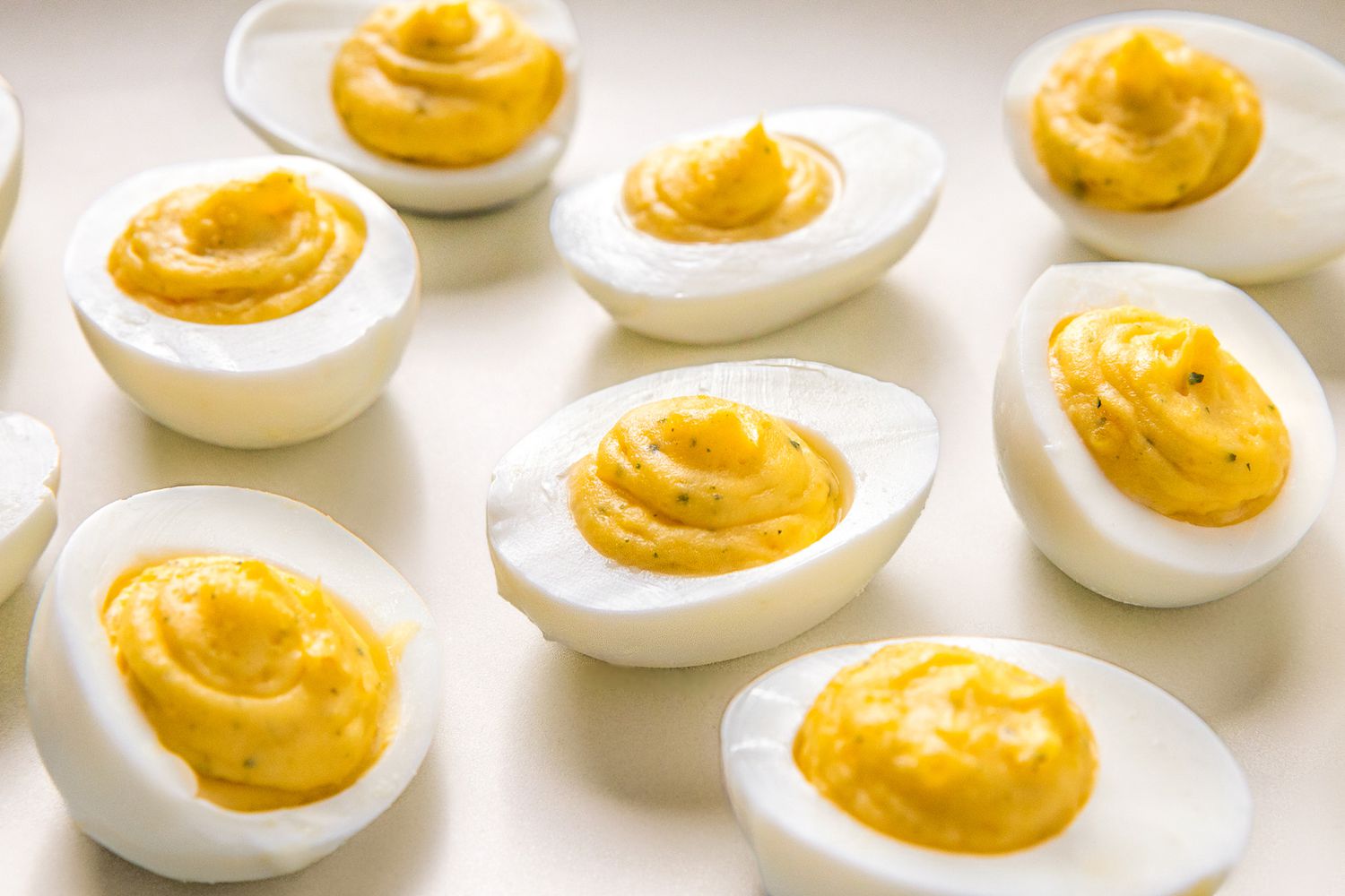 Deviled eggs with a ranch seasoning flavor, arranged on a surface