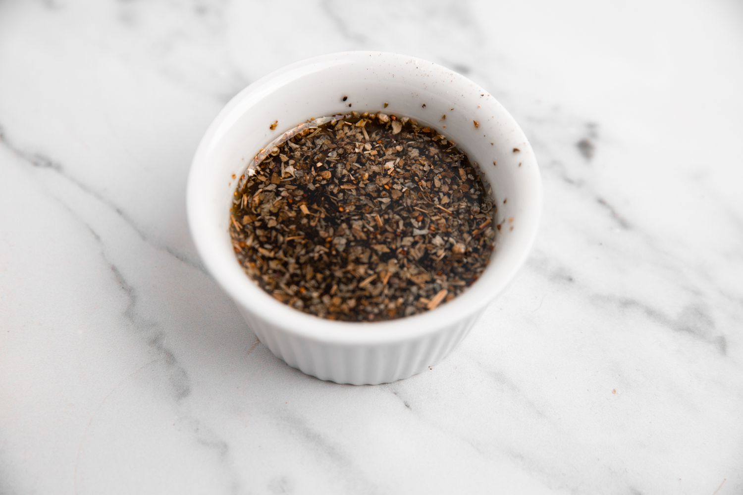 Bowl of Marinade for Grilled Chicken Caprese Sandwich Recipe