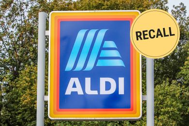 A sign with the Aldi logo and a yellow label reading recall overlayed