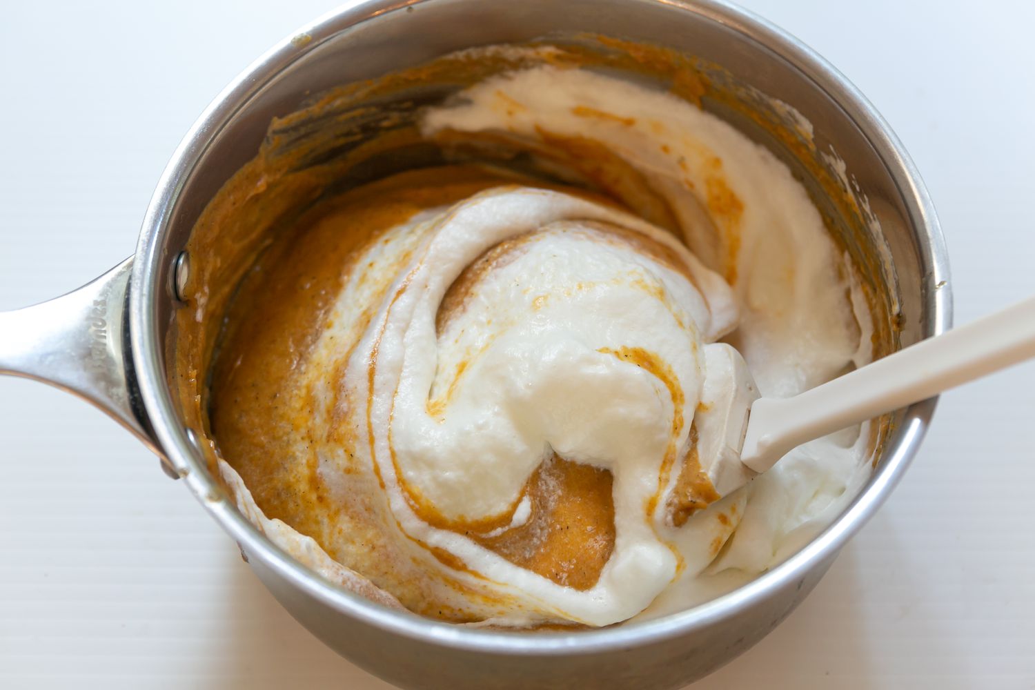 folding egg whites in pumpkin chiffon pie mixture 