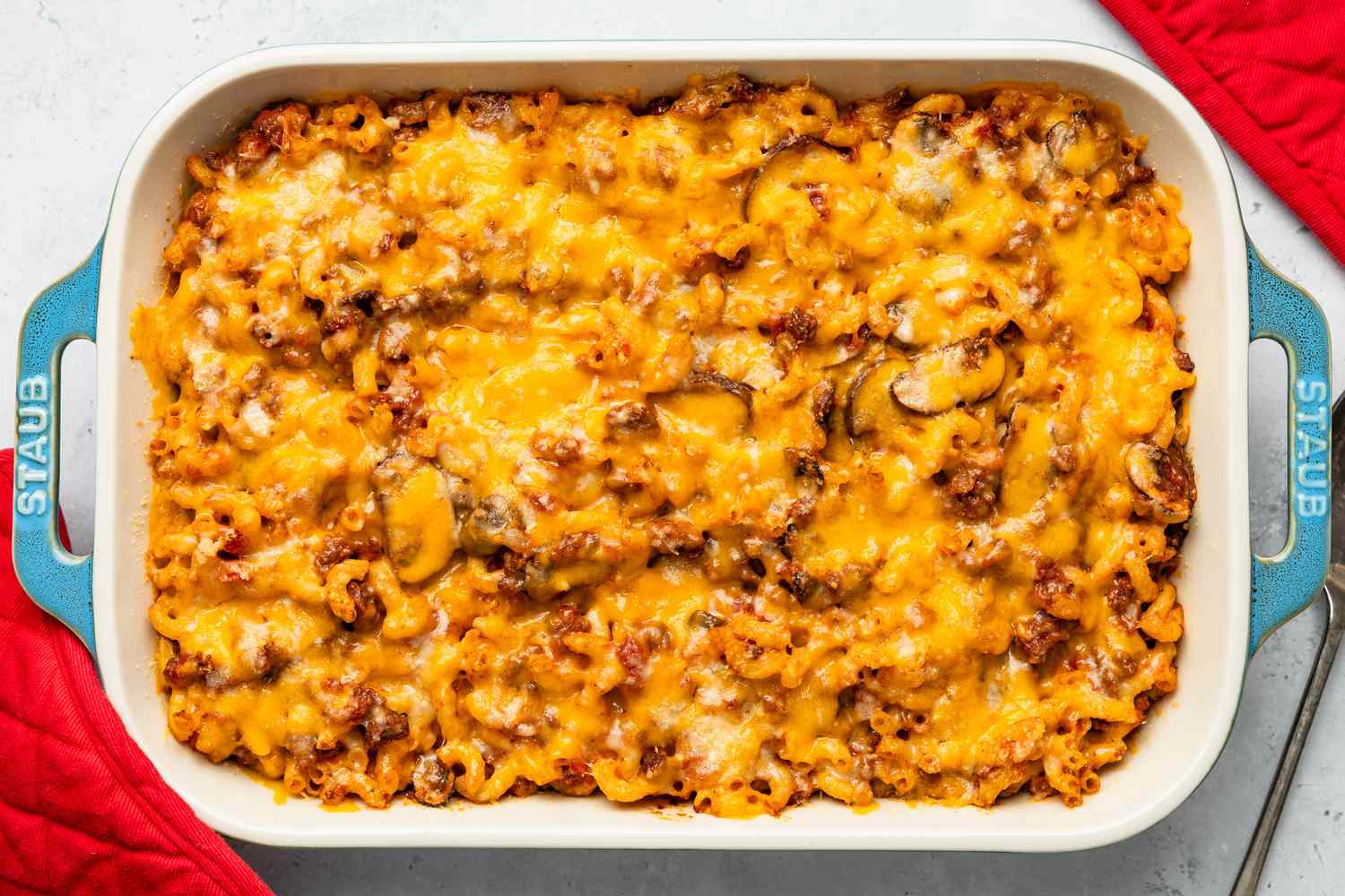 Baked pasta casserole topped with melted cheese in a rectangular dish
