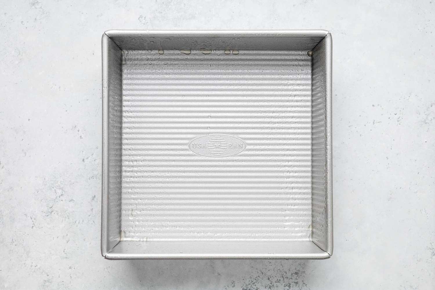 Baking sheet sprayed with cooking oil