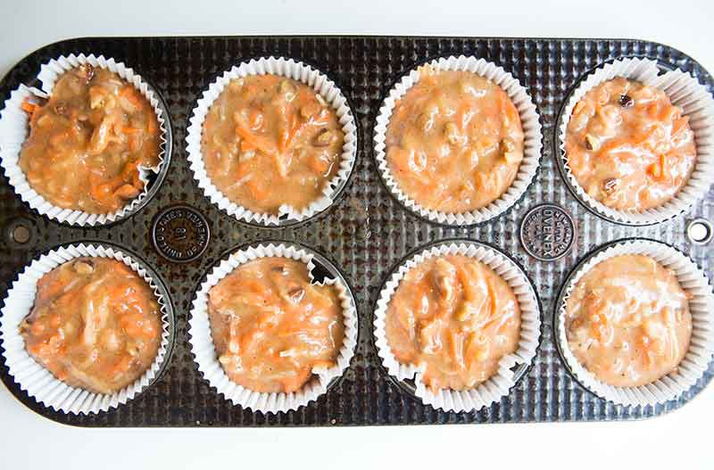 Carrot Cake Cupcakes Eight uncooked carrot cupcakes in muffin tin