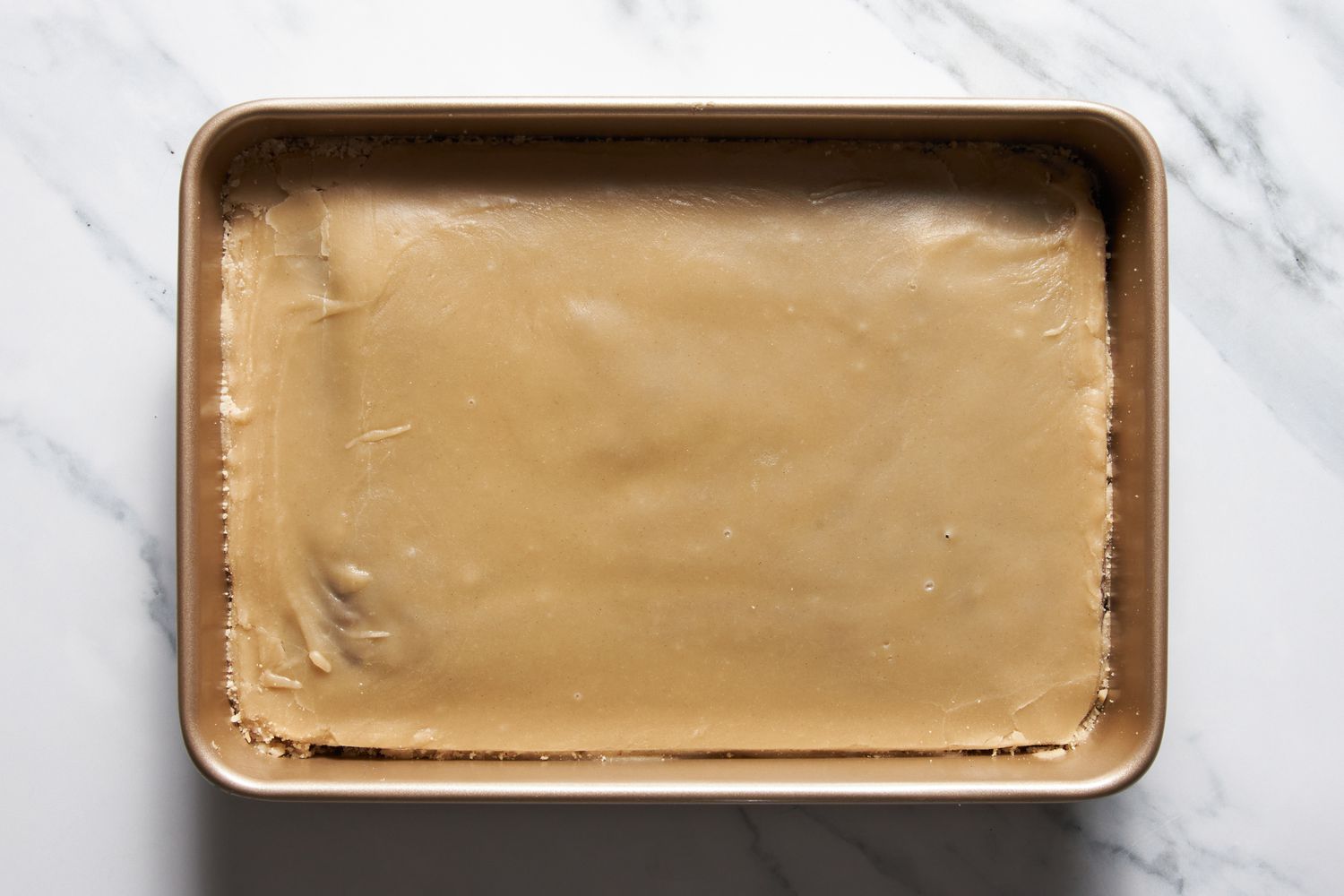 Icing spread until Dr. Pepper cake is completely covered