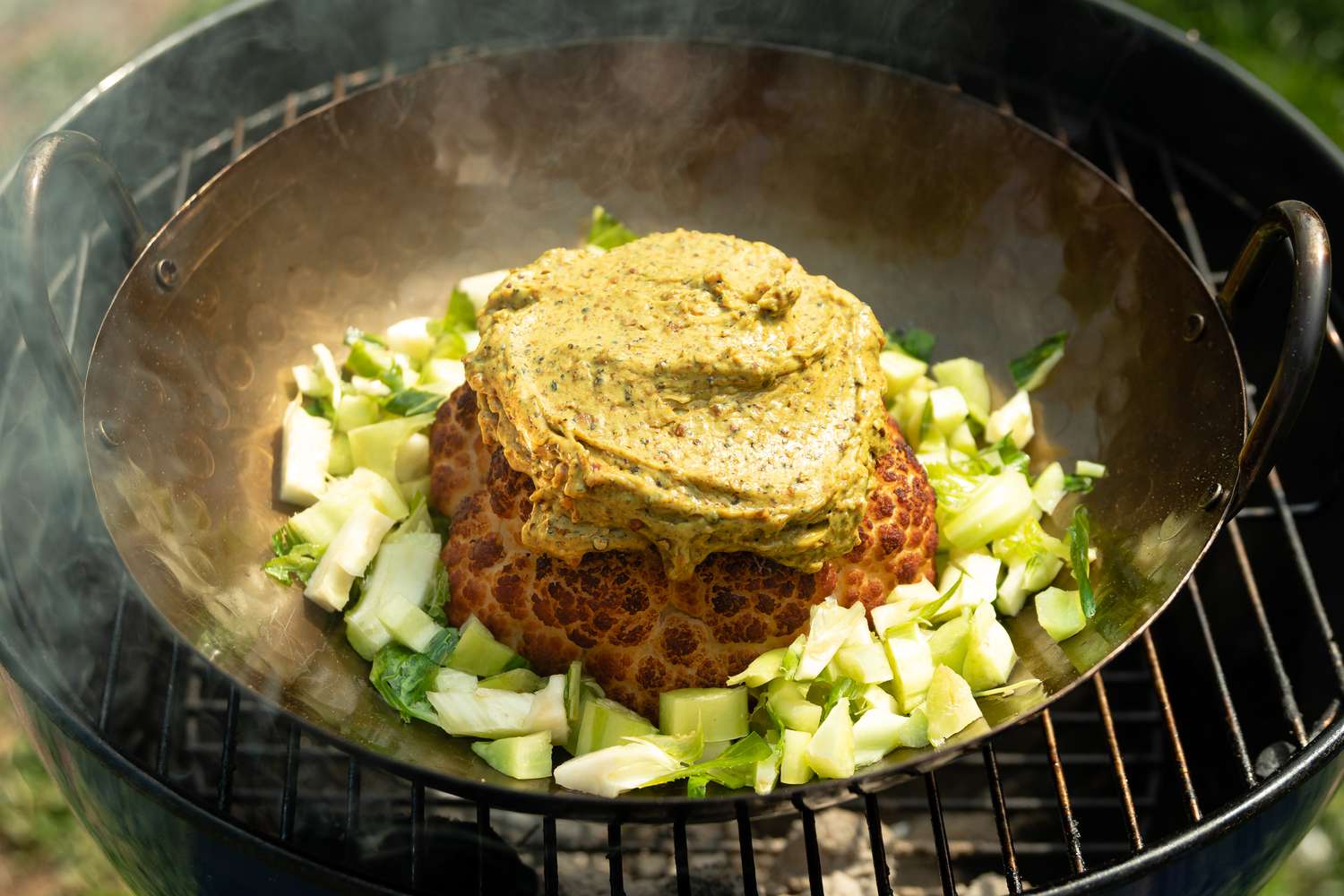 Smoked Whole Cauliflower with Spiced Soy Butter and Satay Sauce in Grill