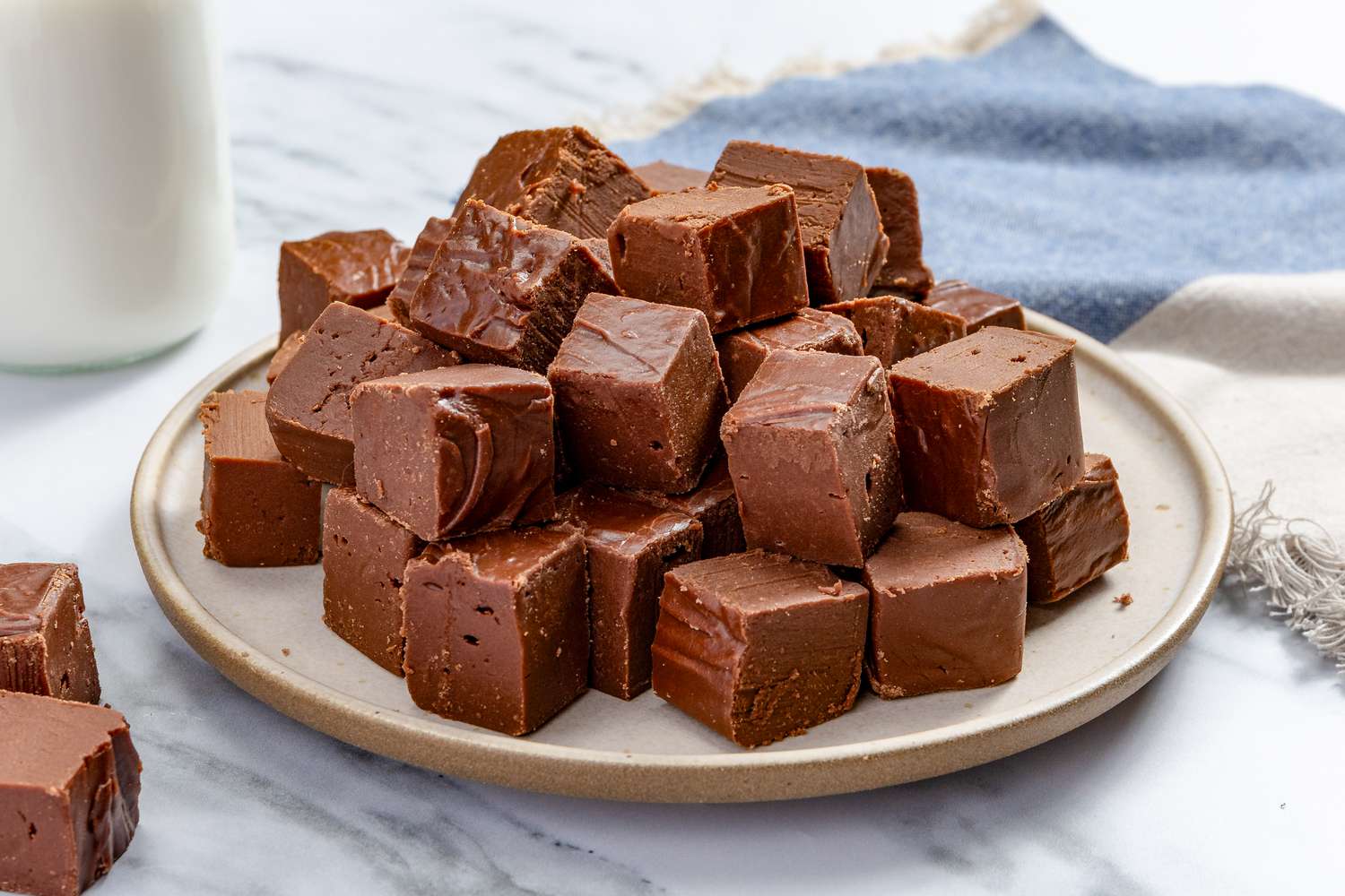Microwave Fudge cut into squares and piled on a platter