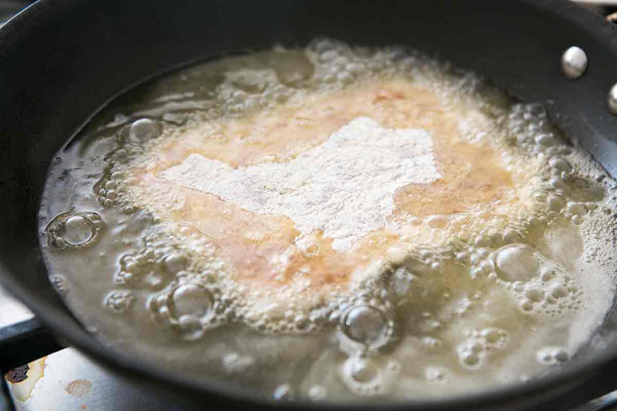 Country fried sirloin in hot oil