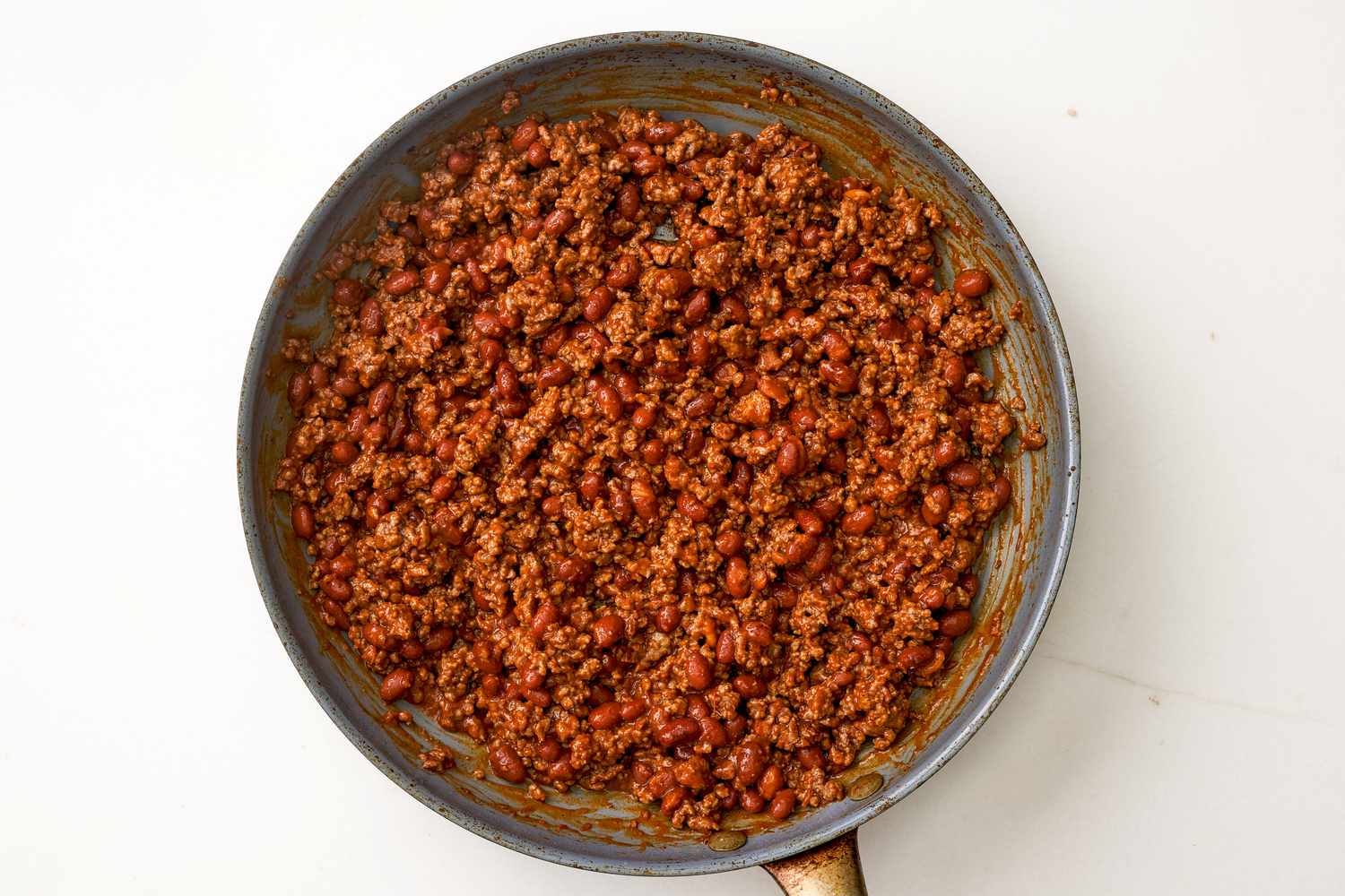 Chili mixed with cooked ground beef for chili dip recipe