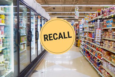 A supermarket aisle showing shelves of products with a Recall notice overlaid
