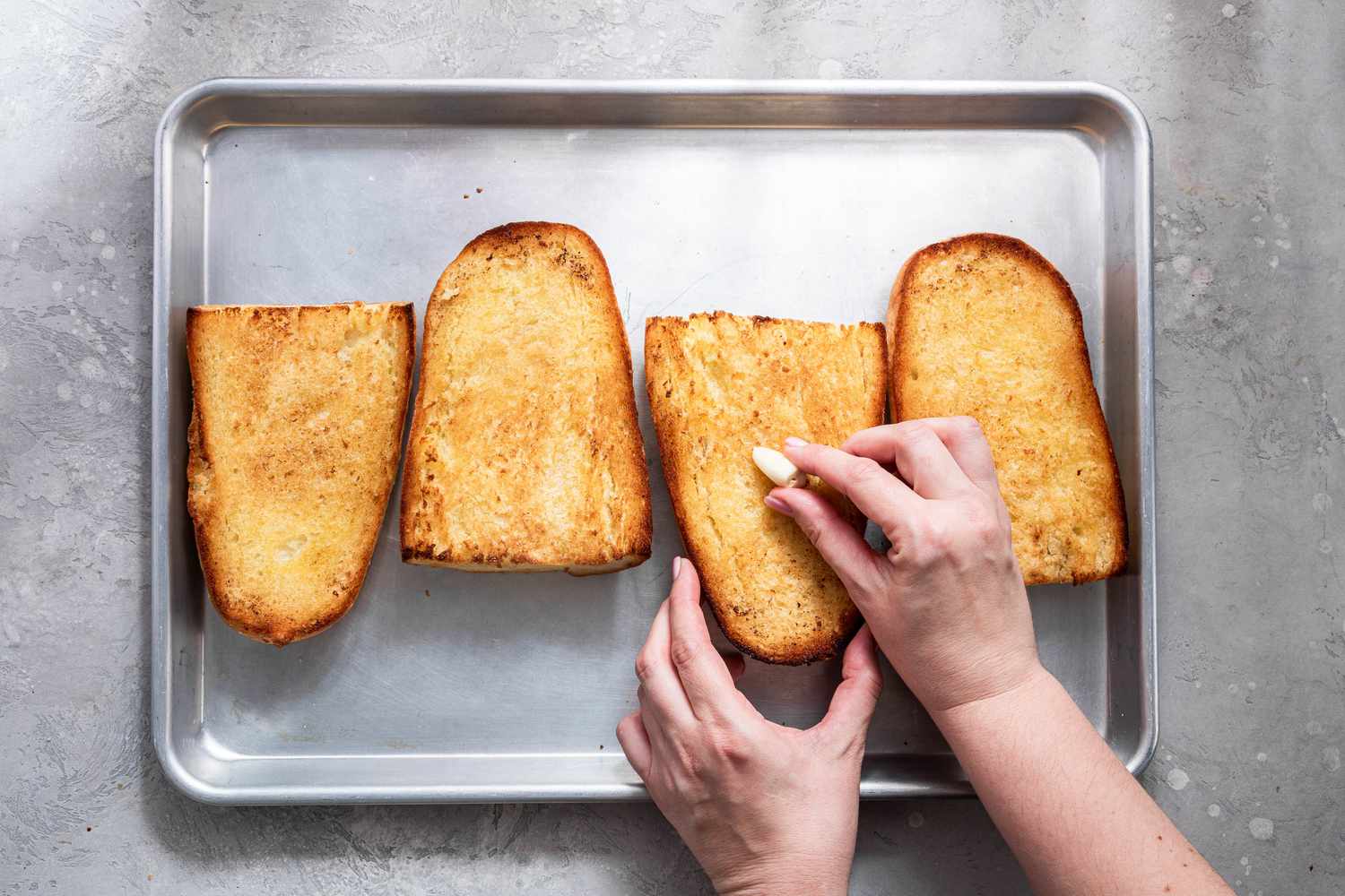 Clove of Garlic Rubbed Onto the Toasted Bread Pieces on the Baking Sheet