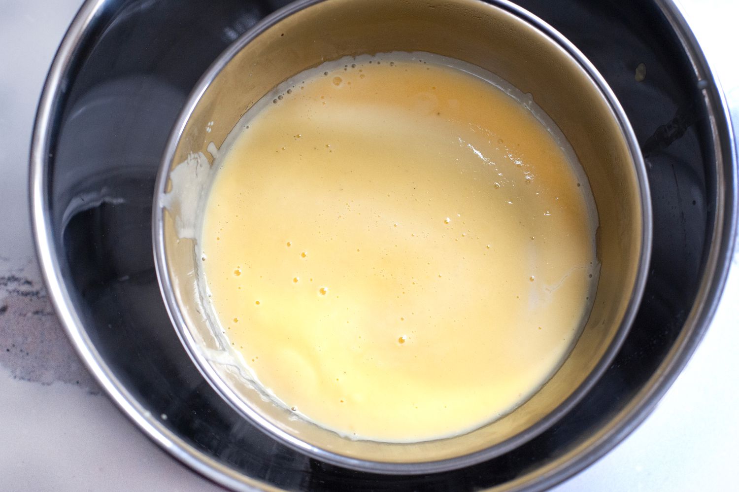 Cooing the base of mint chocolate chip ice cream.