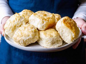 Southern Biscuits with White Lily Flour - hands holding a plate of biscuits