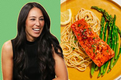 Joanna Gaines next to a plate of roasted salmon with asparagus and spaghetti