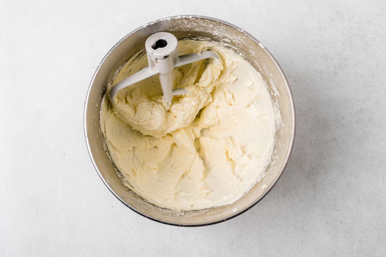 Creamed butter and sugar to make chocolate shortbread.
