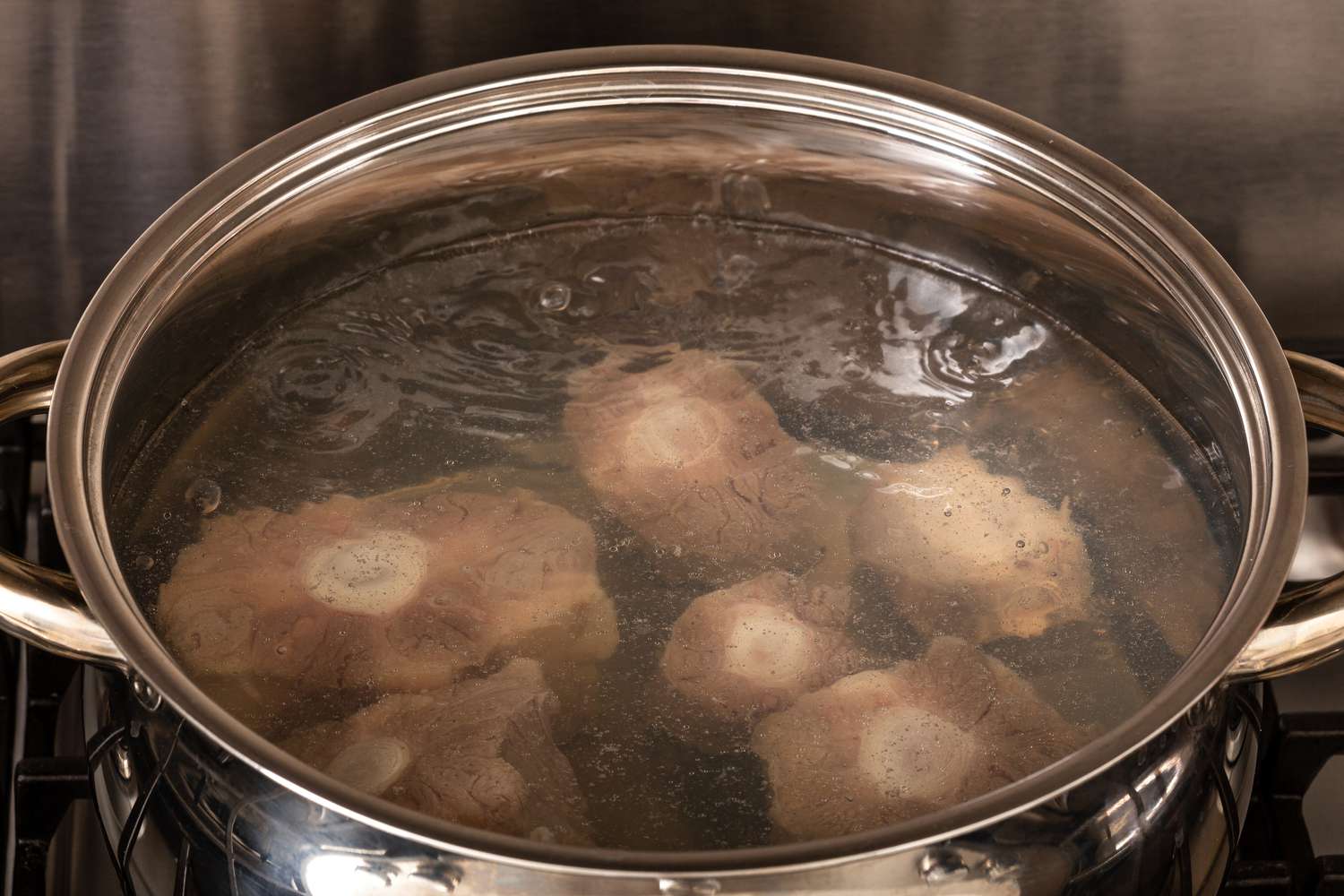 Oxtails blanching in a pot