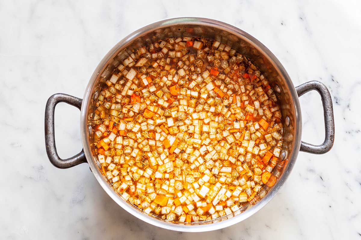 Pot of diced vegetables in water.