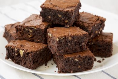 homemade brownies stacked on a plate