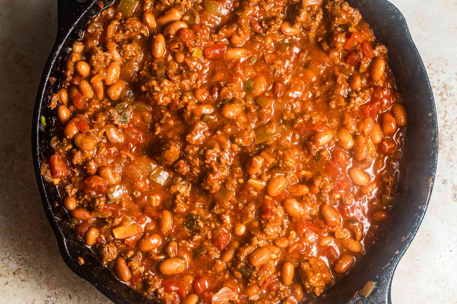 Walking taco casserole filling in a cast iron skillet
