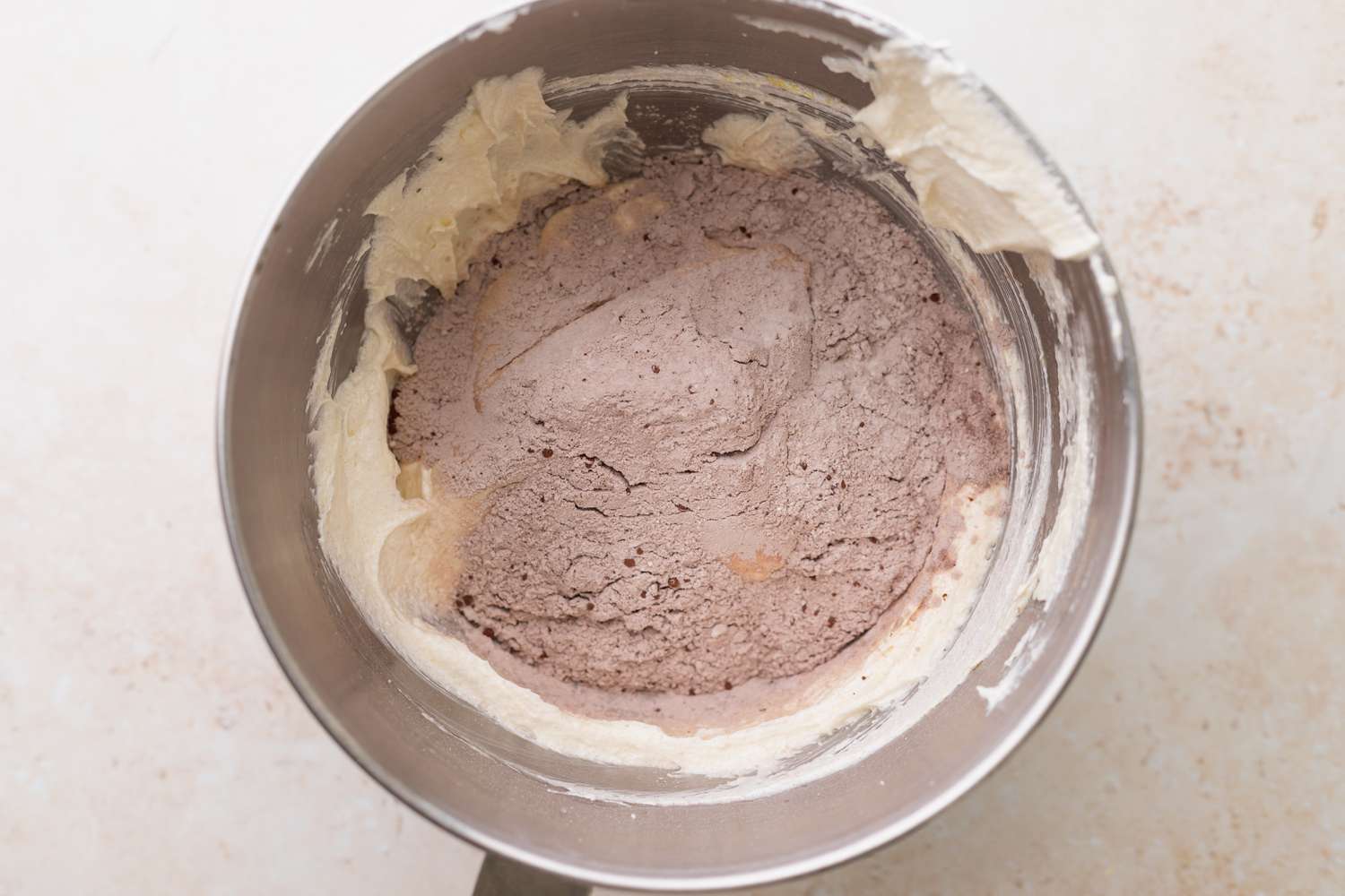 Combine the wet and the dry to make the batter for the red velvet cakes 