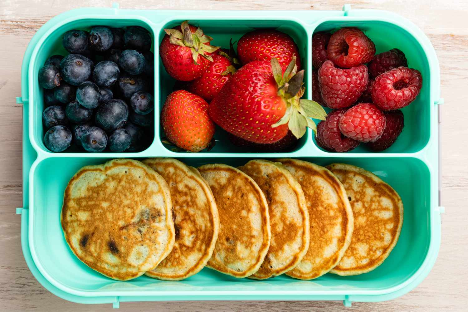 Buckeye Pancake, Blueberries, Strawberries, and Raspberries in Tupperware