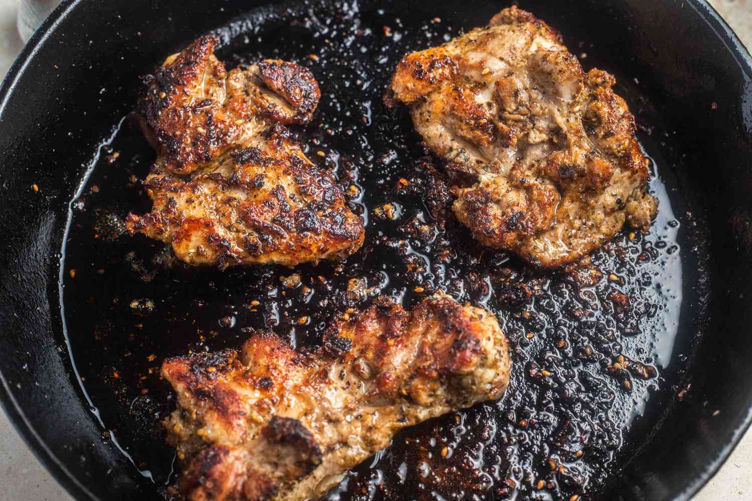 Marinated Chicken Thighs Cooked on a Cast Iron Skillet 